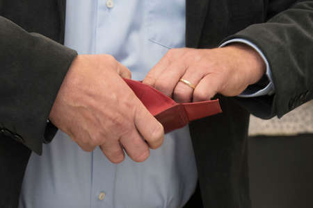 opening a red leather wallet