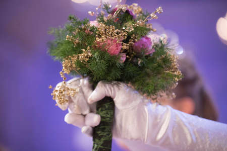 holding a wedding bouquet in handの写真素材