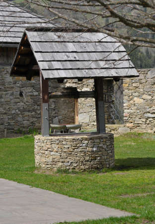 stone well or draw well with wooden roofの写真素材
