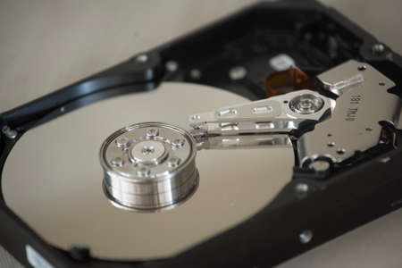 opened hard disk drive, a digital storage medium with mechanical components
