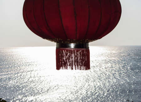 wide open sea with a paper lantern in the foregroundの写真素材