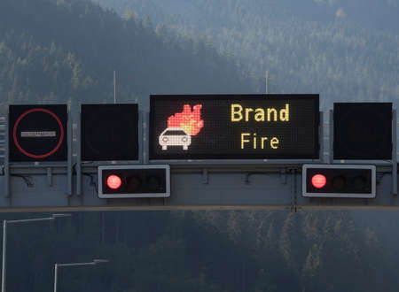 fire warning sign at the entrance of a road tunnelの写真素材