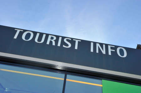 Tourist Information sign on a building, on a black backgroundの写真素材