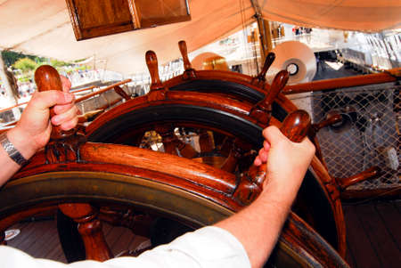 a steering wheel on a ship, to control the rudder