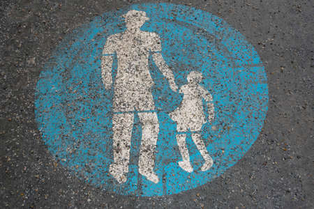 pedestrian traffic sign on the street, blue sign, white pedestrians pictogramの写真素材