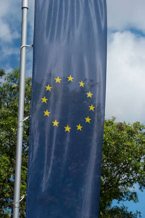 European Union flag, blue flag with yellow stars representing the EUの写真素材