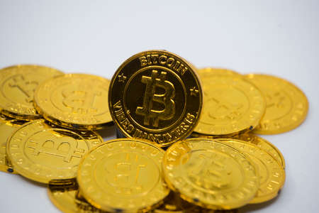 golden bitcoins coin on white background representing the electronic currencyの写真素材