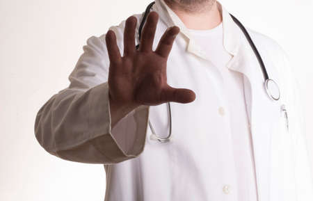 physician or doctor in white coat, symbol for illness and healthの写真素材