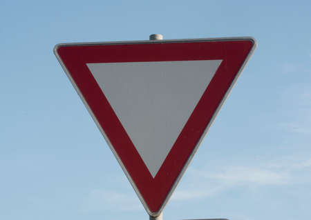 a give way or yield traffic sign on the street