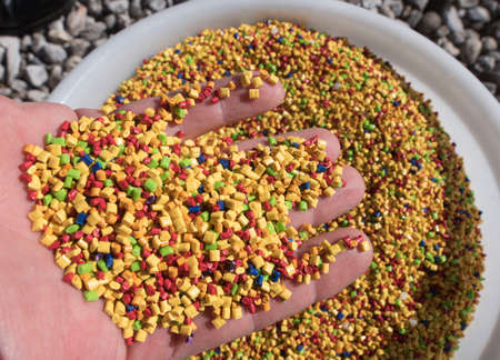 small and colorful plastic pieces used in the industrial production