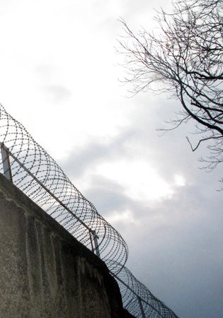 barbed wire as barrier in a prison, measure to prevent outbreaks