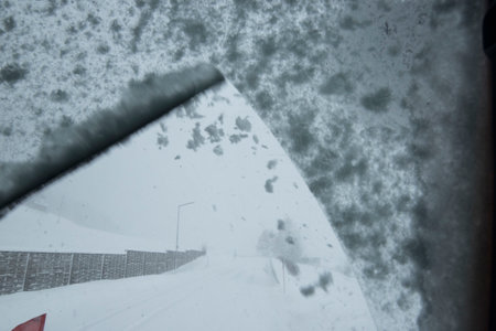 car and snow in winter, road traffic and mobility in a snowy landscapeの写真素材