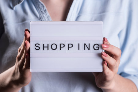 a shopping sign as symbol for consumption, business and economyの写真素材