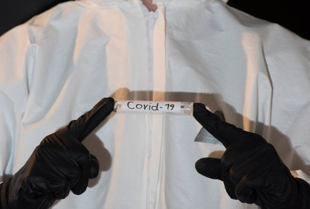 test tube with COVID-19 label, corona virus pandemic and health