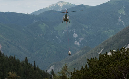 load transport with a helicopter, transporting cargo in the airの写真素材