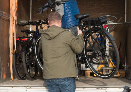 bicycle and car in road traffic, mobility with different vehicles