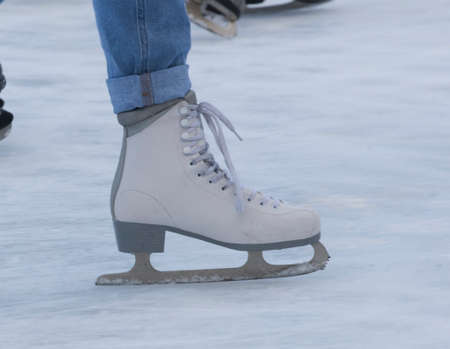 ice skating and sports in winter on a skating rinkの写真素材