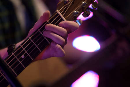 playing the guitar, a stringed instrument, musical instrument in art and culture