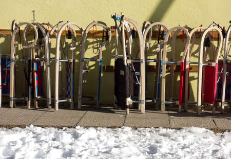 tobogganing or sledging after snowfall on a cold winter day