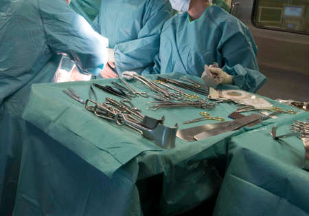 a surgery in an operation room in the hospital, medical intervention