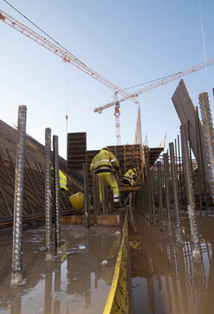 construction worker in hydraulic engineering, construction works and water management