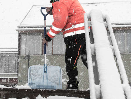 snow removal with a snow shovel in the winter time