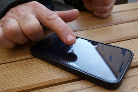 smartphone, a mobile communication device with touchscreen and rechargeable battery