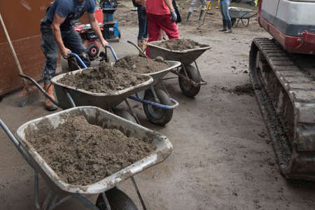 different people working and  helping together in the neighborhood assistance
