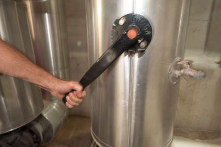 manual opening or closing a valve in an industrial plant