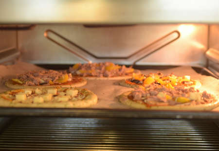 pizza, an italian dish topped with tomato, cheese and other ingredients