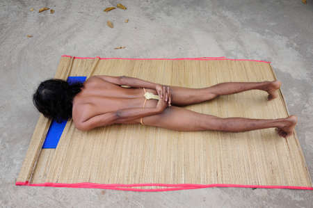 a person during yoga exercise, training for mental and physical healthの写真素材