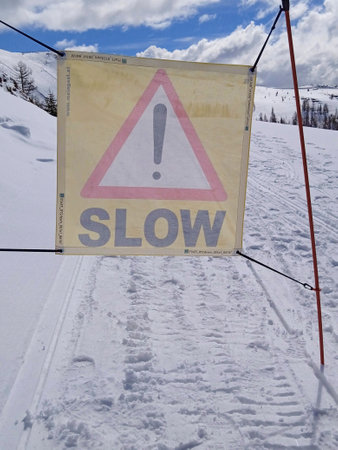 danger warning sign and accident risk at skiing in winterの写真素材