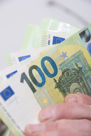 one hundred euro banknote, currency in the european union, business and financesの写真素材