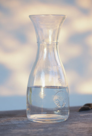 drinking a glass of water for fluid supply and hydration