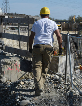 construction worker at a building site, employee in construction industryの写真素材