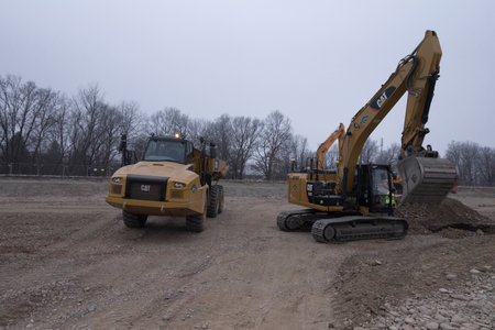 an excavator from the Caterpillar brand in the construction works