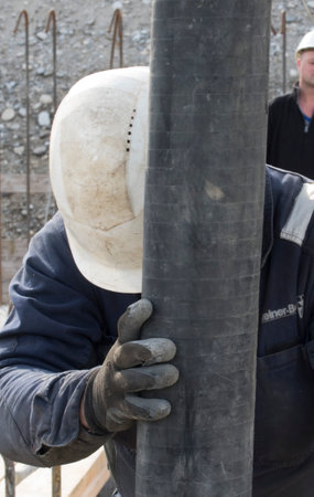 construction worker at a building site, employee in construction industryのeditorial素材