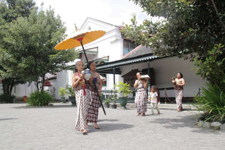 Bringing dish of tea ceremony at the Yogyakarta Sultan Palaceの写真素材