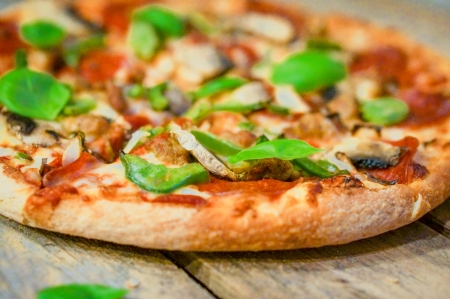 pizza on wooden table 