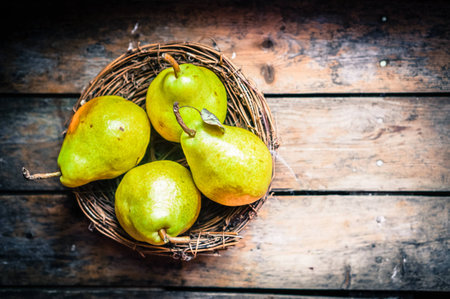 Pears on rustic wooden backgroundの写真素材