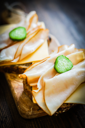 Sandwich with sliced chicken on whole grain breadの写真素材