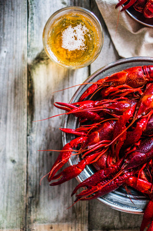 crawfish with beer on wooden table の写真素材