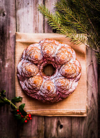 Christmas cake on wooden background