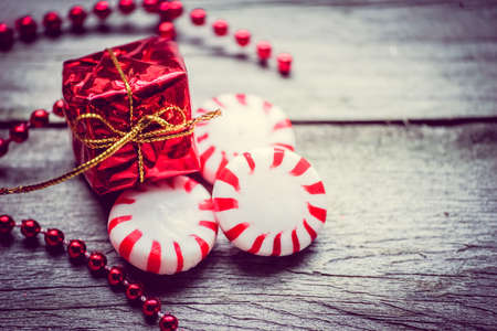 Peppermint candies on wooden background