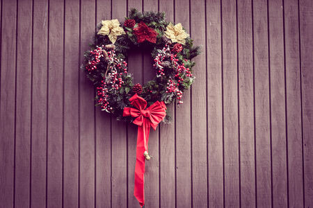 Christmas wreath on wooden backgroundの写真素材