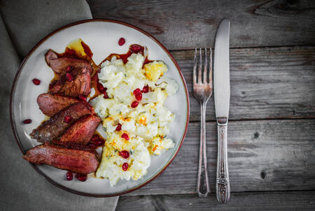 Grilled steak with cauliflower and pomegranateの写真素材