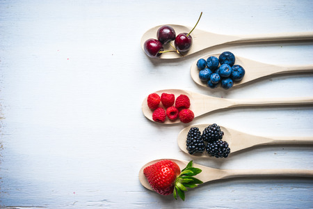 Berries on wooden backgroundの写真素材