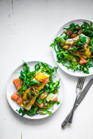Grilled fish with arugula saladの写真素材
