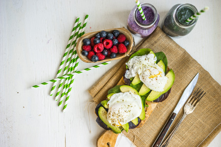 Healthy sandwich with avocado and poached eggsの写真素材