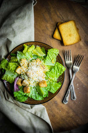 Caesar salad on rustic backgroundの写真素材